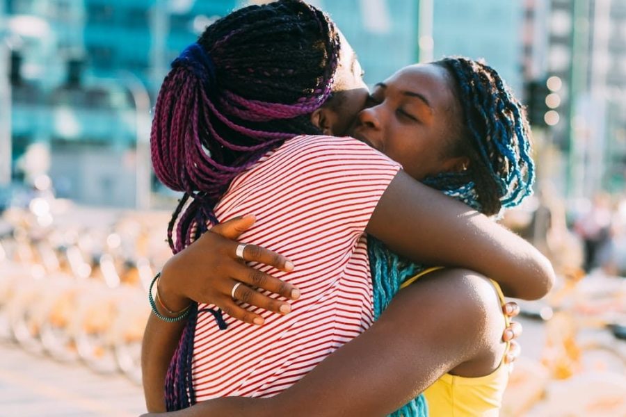 two-young-women-black-hugging-outdoor-comforting-and-bonding